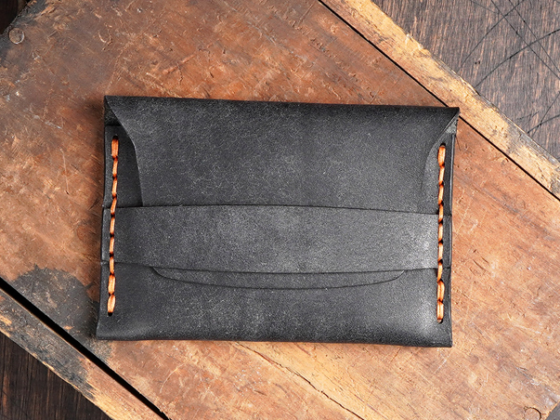 finished leather flap wallet with minimalist flap design and hand stitching