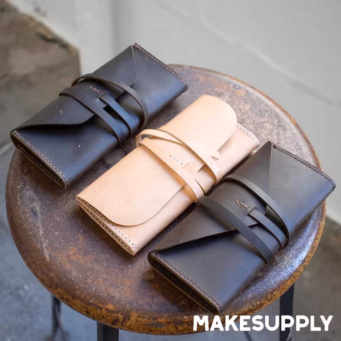 leather clutch pattern showing finished clutches made from free PDF template