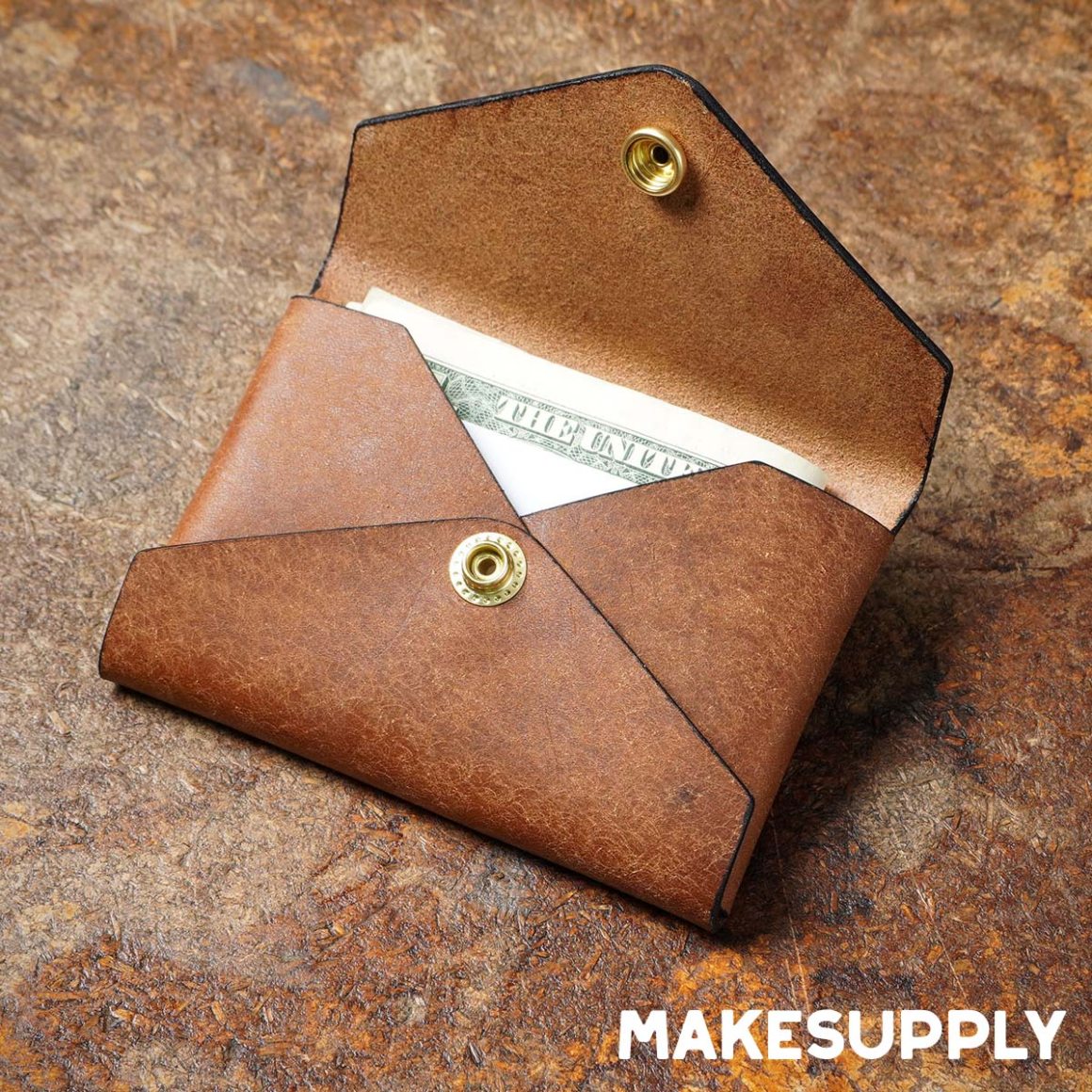 open no stitch leather card holder showing folded cash and snap closure
