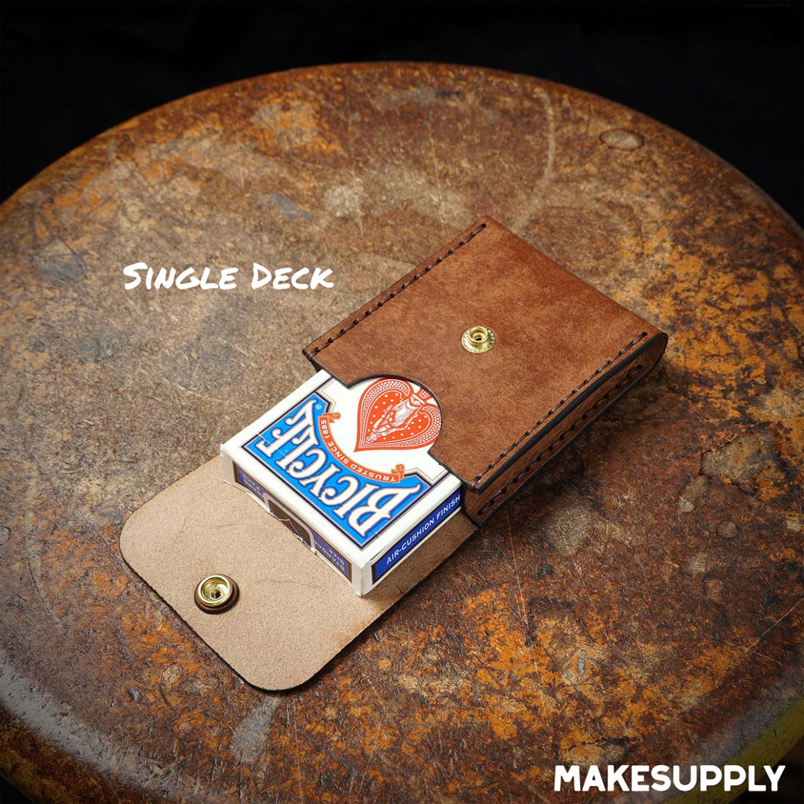 single deck leather playing card case holding one deck of cards