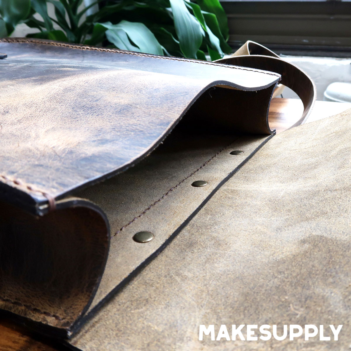 leather map case pattern detail showing gusset and rivet construction