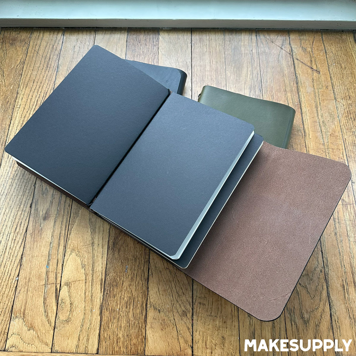 Interior view of A5 trifold leather journal covers holding notebook inserts