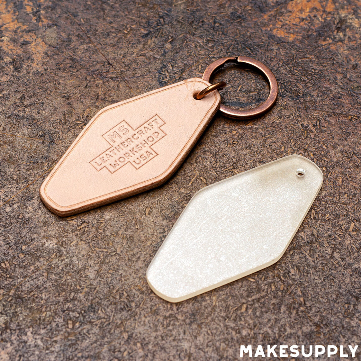 leather hotel key fob next to acrylic template used for cutting the pattern