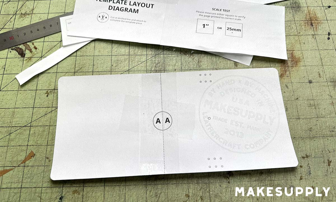 The completed assembled template cut out and ready to use, with paper scraps in the background.