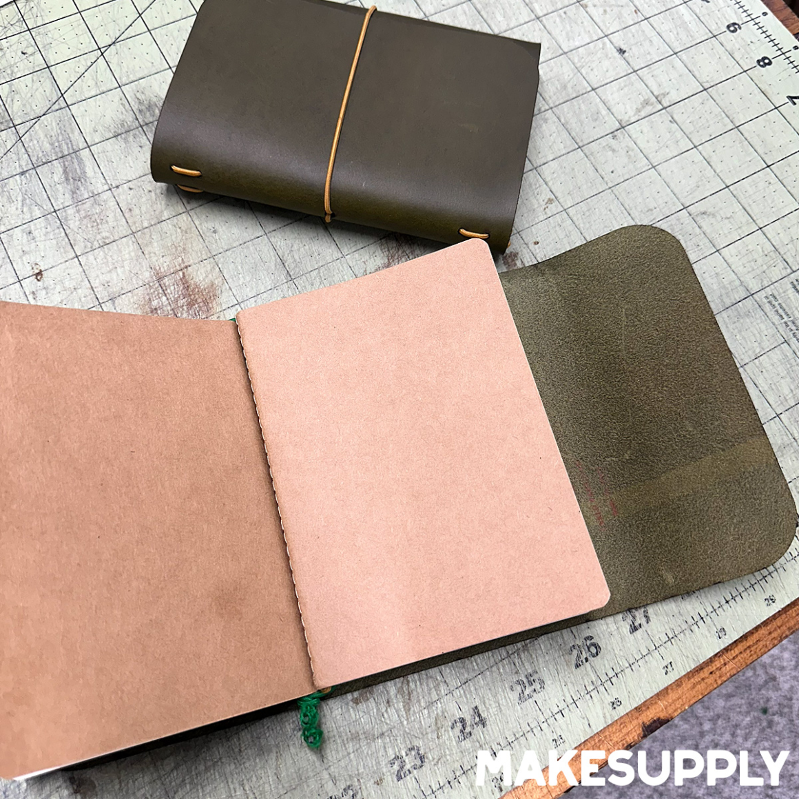 Interior of an A6 trifold leather traveler notebook cover holding A6 notebook inserts