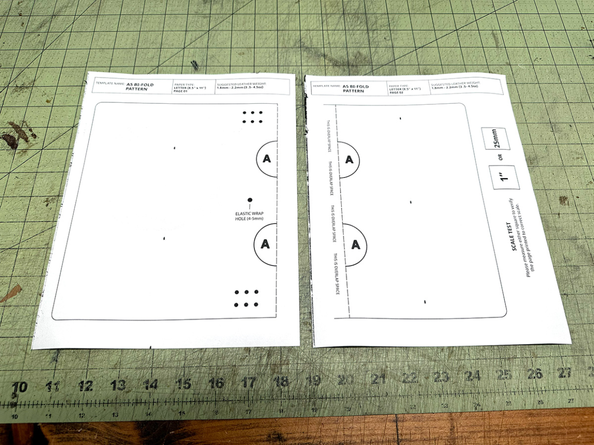 A5 bifold leather notebook cover pattern printed on two letter-size pages shown side by side on a cutting mat